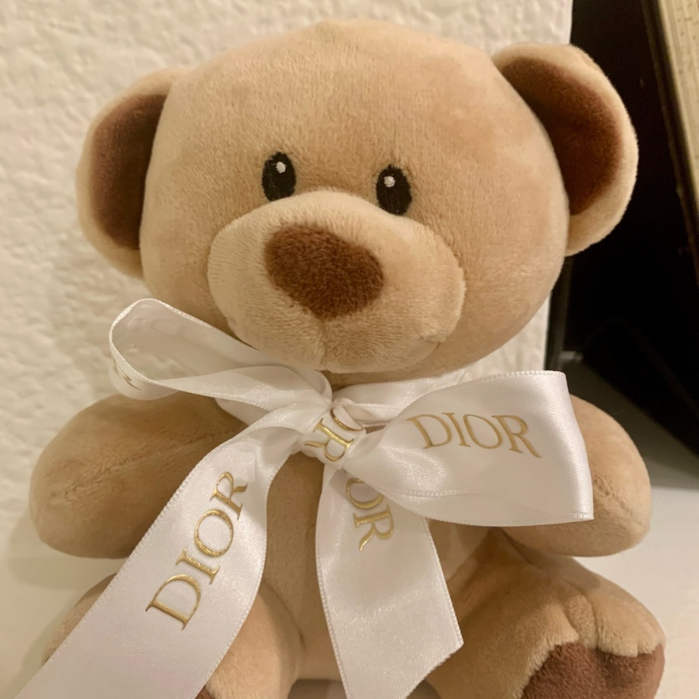 Mini TY beanie baby with white DIOR ribbon.